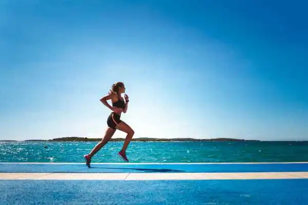 Woman running showing strong leg muscle Cardonald
